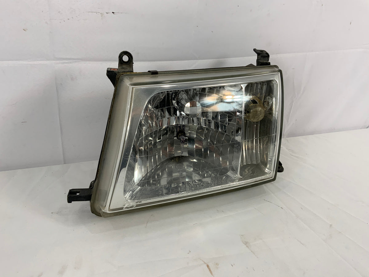 Used - Left Head Light - 100 Series 1998-2005